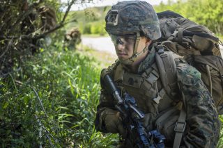 190511-M-QP663-0009 MARINE CORPS TRAINING AREA BELLOWS, HAWAII (May 11, 2019) U.S. Marine Corps Lance Cpl. Samuel Nunez, a rifleman with India Company, Battalion Landing Team 3/5, 11th Marine Expeditionary Unit (MEU), watches for enemies during a patrol. The Marines and Sailors of the 11th MEU are conducting routine operations as part of the Boxer Amphibious Ready Group. (U.S. Marine Corps photo by Cpl. Adam Dublinske)